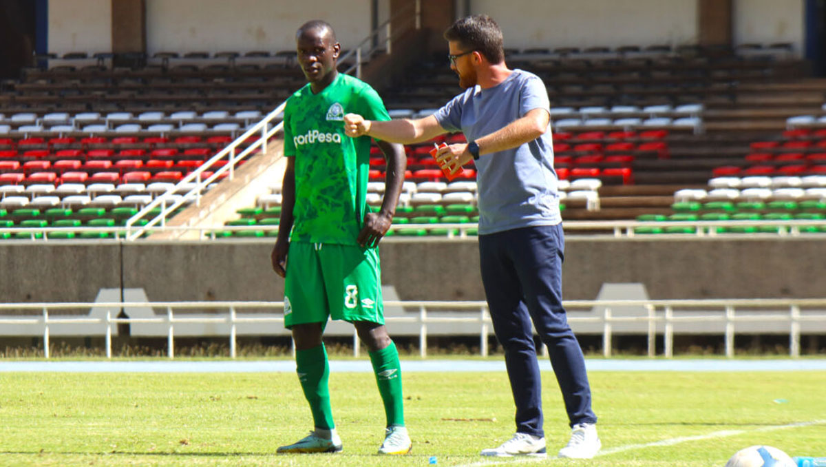 Gor Mahia head coach Jonathan McKinstry with left-back Geoffrey Ochieng. PHOTO/Timothy Olobulu